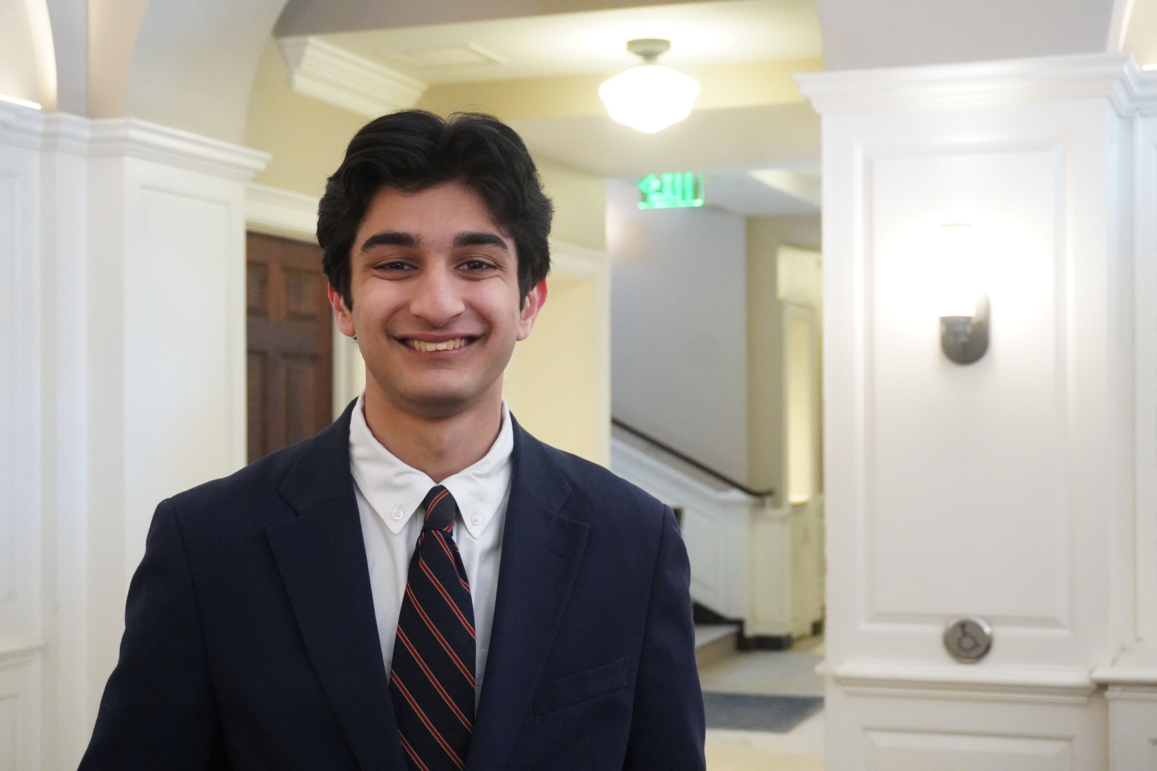 On a chilly winter morning, a slow trudge back from assembly might feature the unexpected belt of an excited Exonian: “Good morning Exeter!” He is your host, Shay Kashif.